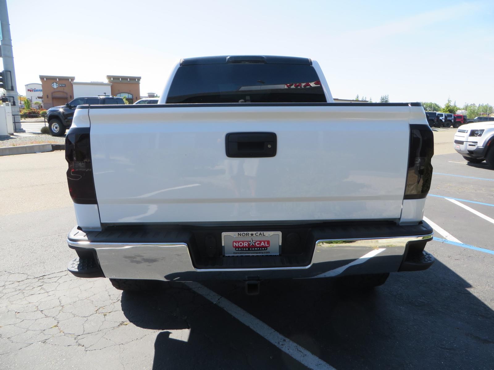 2018 White /BLACK Chevrolet Silverado 1500 LT (3GCPCREC7JG) with an 5.3L V8 OHV 16V engine, automatic transmission, located at 2630 Grass Valley Highway, Auburn, CA, 95603, (530) 508-5100, 38.937893, -121.095482 - Must see Pre Runner.... CST front lift spindals, Camburg UCA's, King Adjustable 2.5 Coil-overs, King 2.5 rear shocks, 35" Toyo RT Trail tires, 17" Method Race wheels, MZ front skid plate, G2 rear differntail cover, Full size bed mounted spare tire, Black Vinyl roof wrap, smoke tail lights and 3rd br - Photo #5
